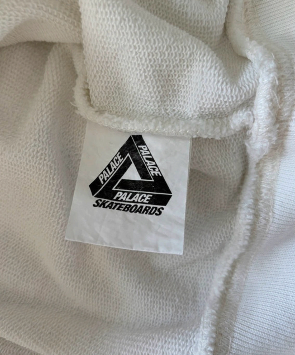 Aurora Fashion Palace Skateboards white cotton hoodie inner neck label with iconic black triangle logo branding