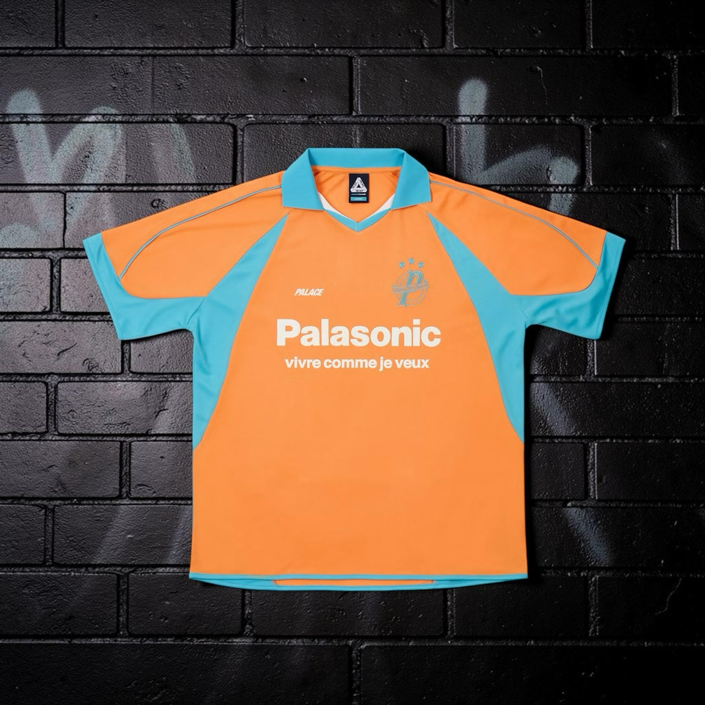 Aurora Fashion Palace orange and turquoise short sleeve sports jersey with Palasonic graphic and polo collar