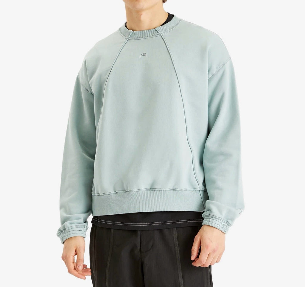 Aurora Fashion sage green A-COLD-WALL* relaxed fit cotton sweatshirt with panelled chest detailing and ribbed trim.