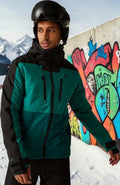 Aurora Fashion men's teal and black waterproof insulated ski jacket with hood worn by a skier in a snowy setting.